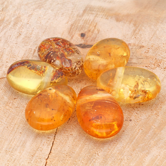 Amber drop pendant with leaf, moss or insect inclusion