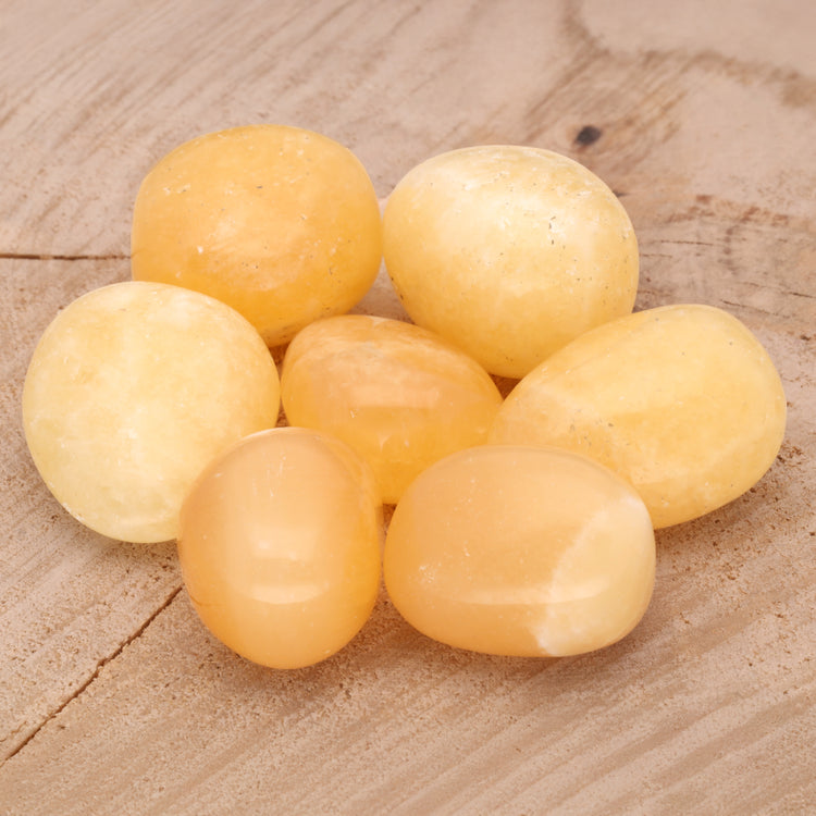 Orange calcite tumbled stone