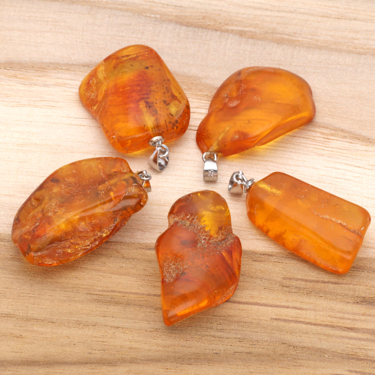 Natural amber pendant | polished | with silver eyelet