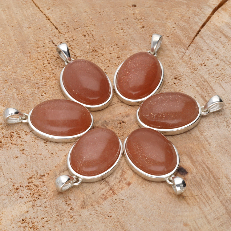 Moonstone, orange pendant (oval) set in silver